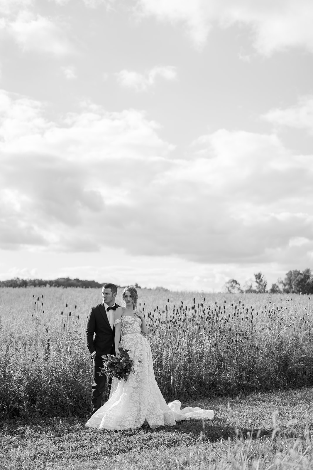 Bride and groom at Magnolia Hill Farm in the field