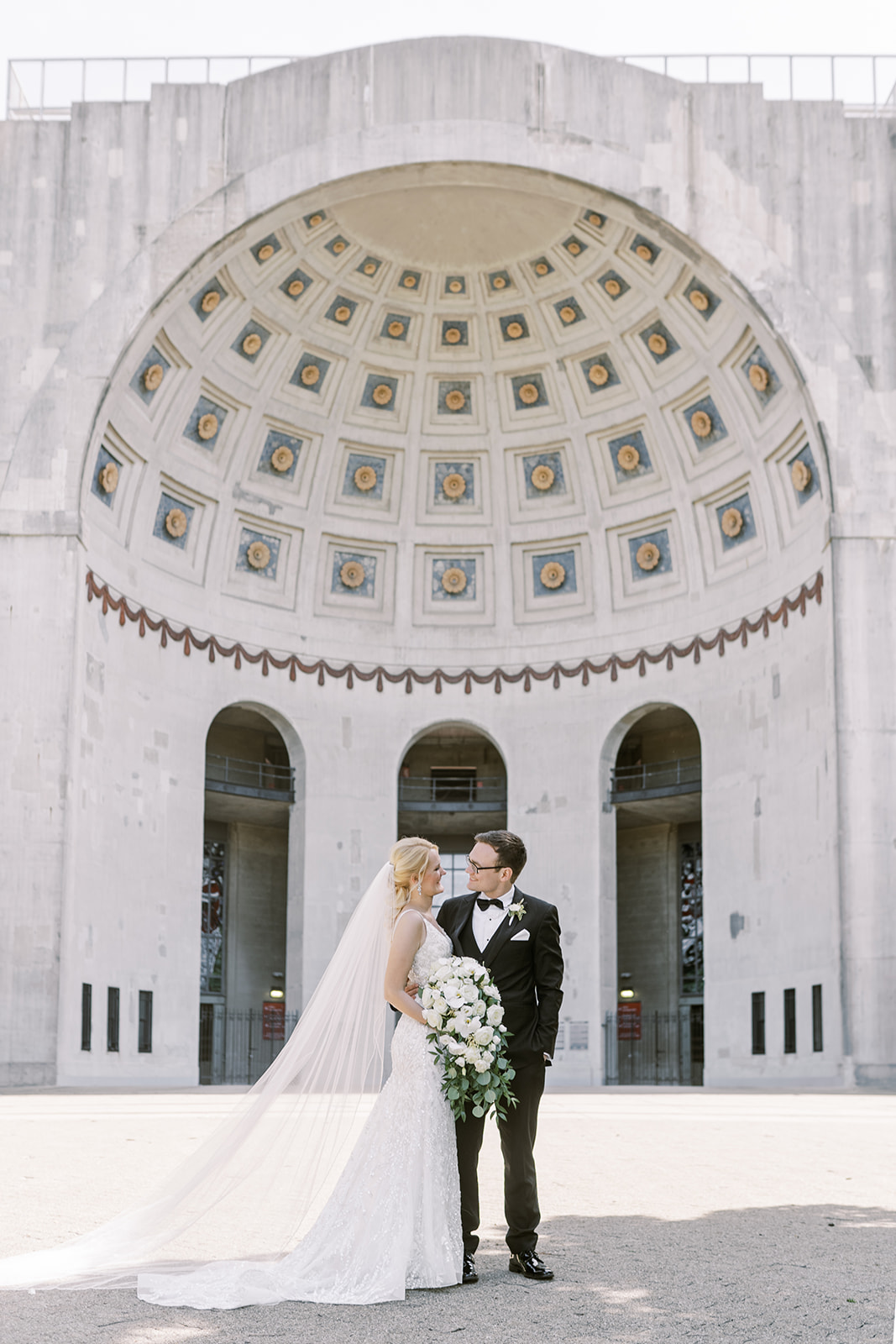 Bride and Groom outside of the Ohio State Stadium