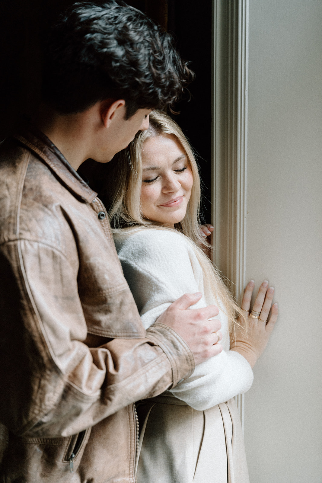 engaged couple at Greencrest Manor on the stairs inside the foyer