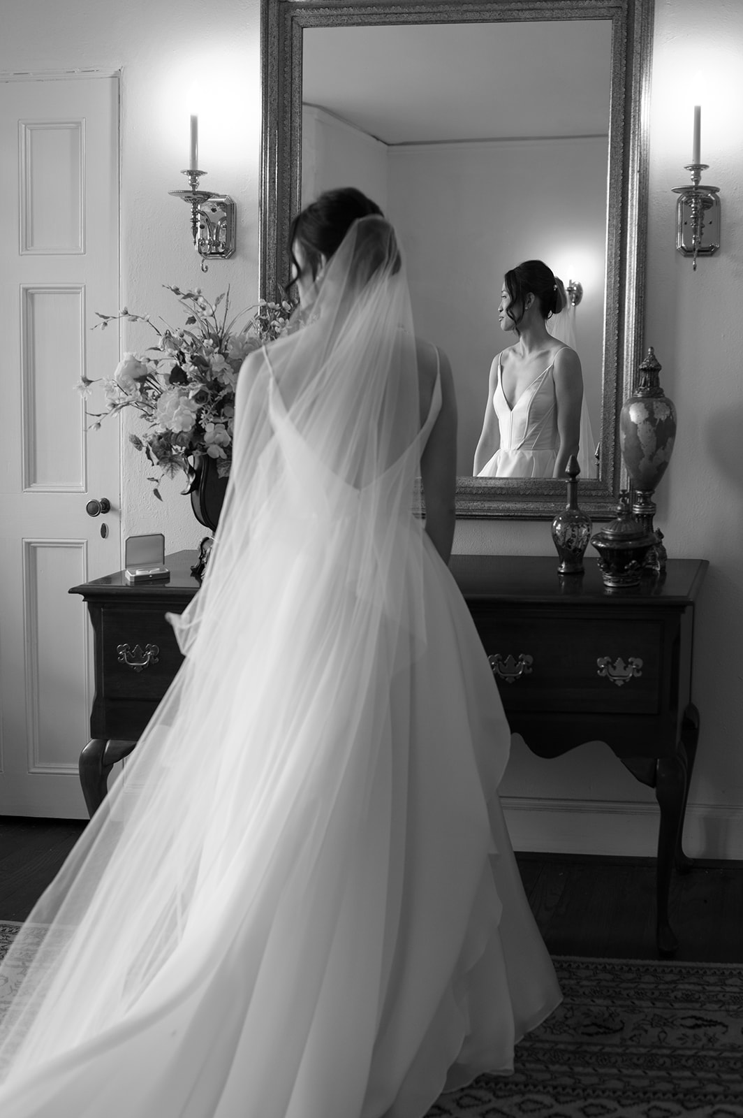 bride standing in front of mirror